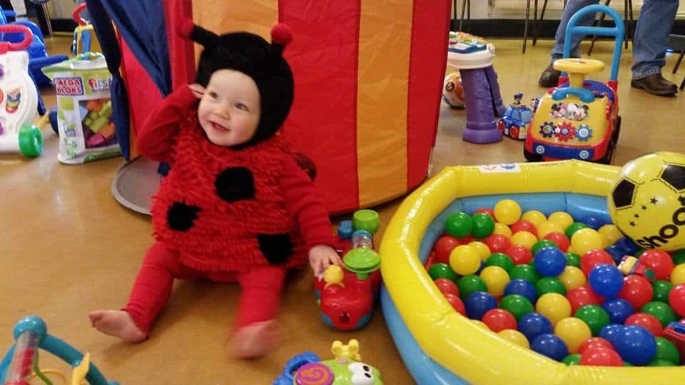 baby dressed as a ladybird