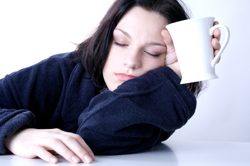 lady asleep with a cup in hand