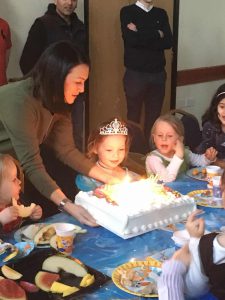 Sofia with her huge Costco birthday cake!