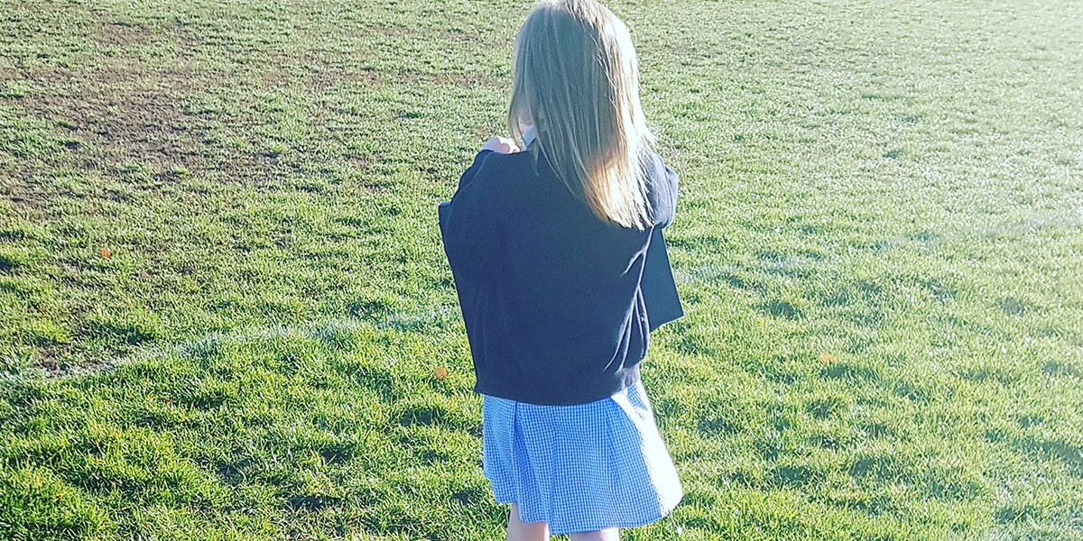 school girl walking to school