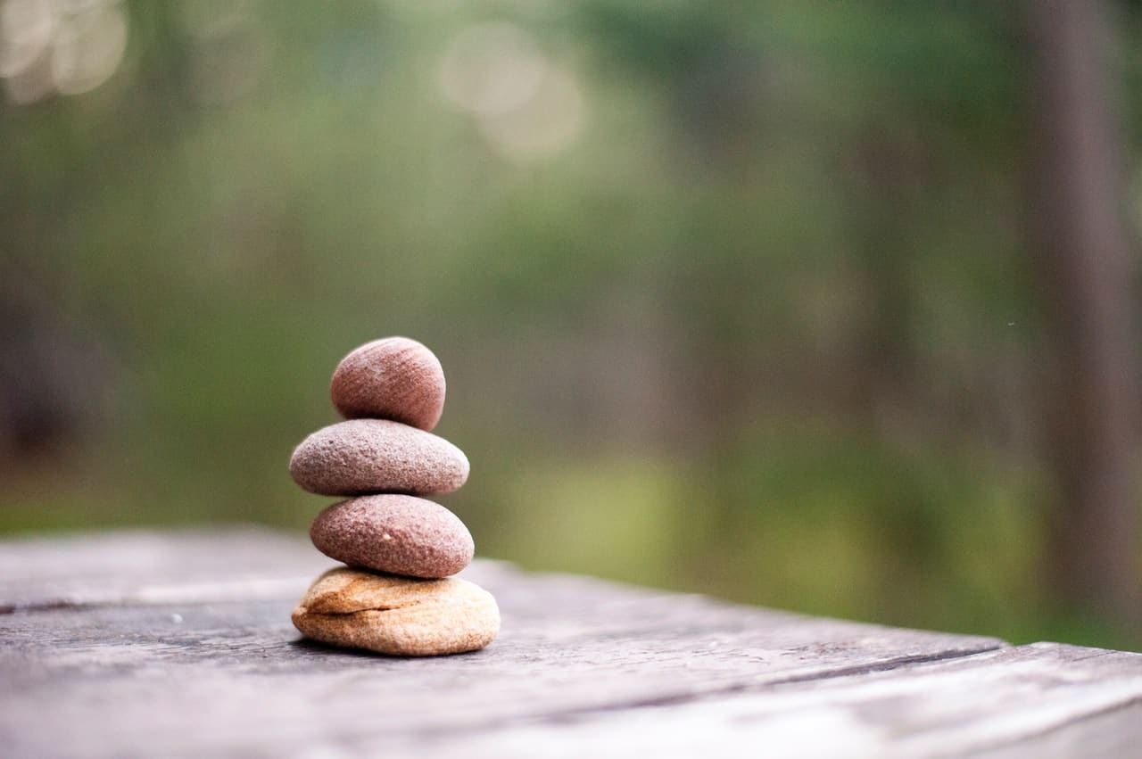 Four pebbles representing peace