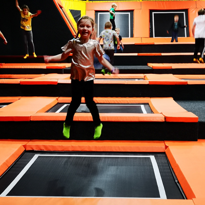 Young girl bouncing on trampoline