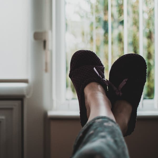 person relaxing in slippers