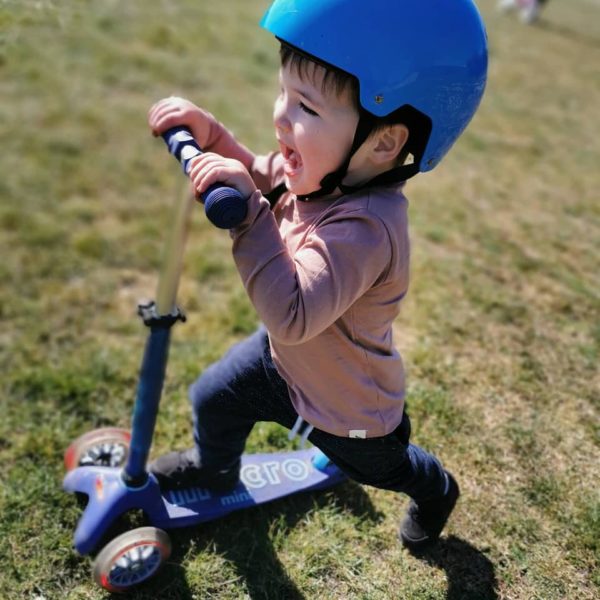 young boy on scooter