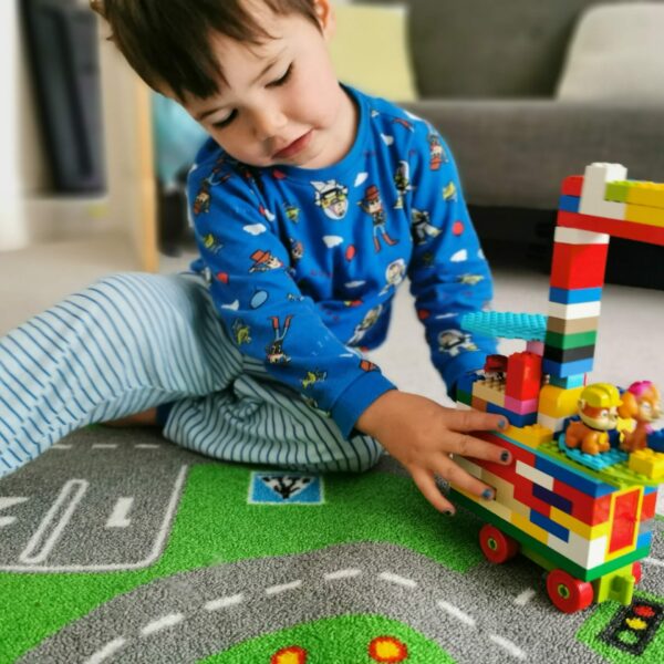 baby boy playing with lego