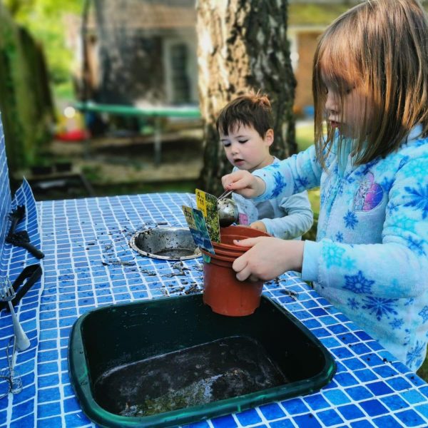 Children playing at mud kitchen