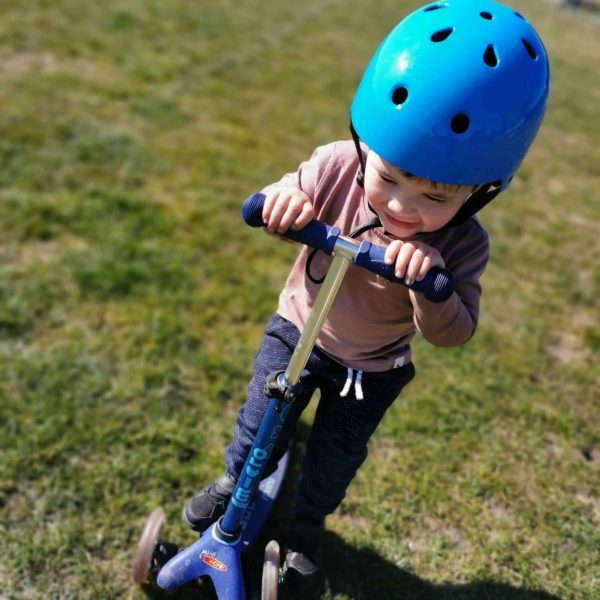 young boy on scooter