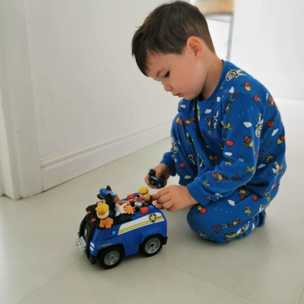 Young Boy playing with Paw Patrol toy