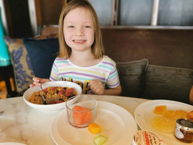 girl eating breakfast in