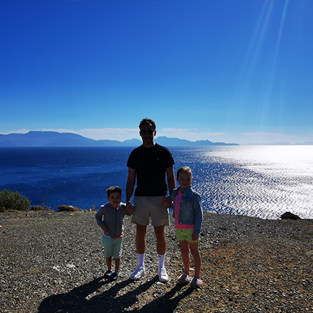 father and two young children at therma beach