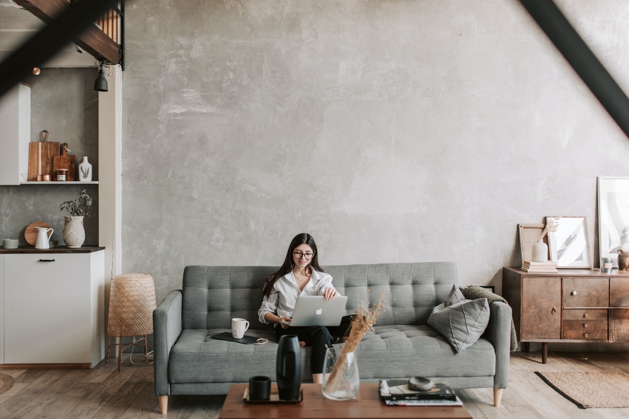 lady sat on sofa at home