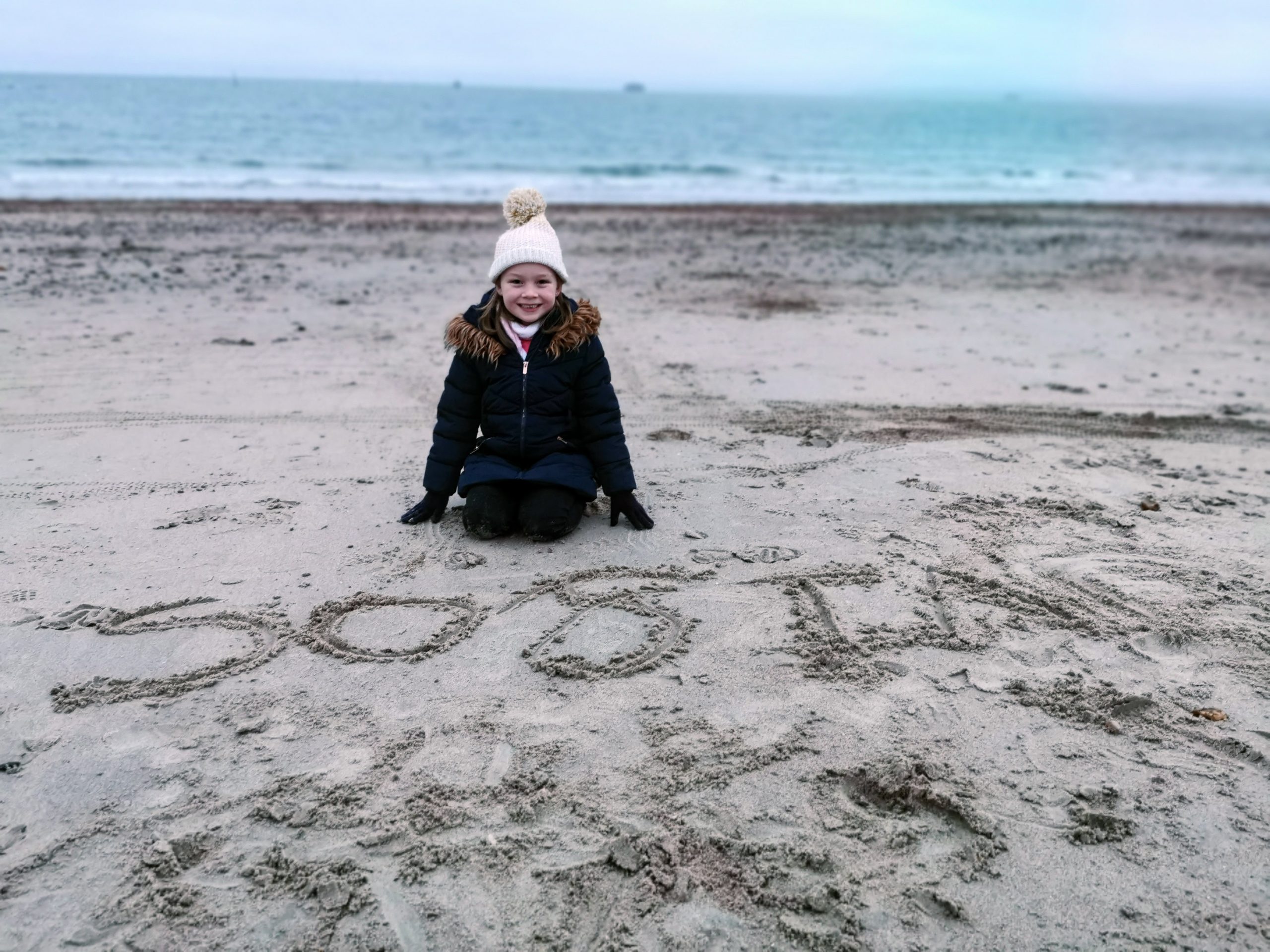 young girl on beach in winter