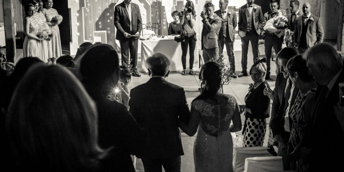 father of the bride walking daughter down aisle