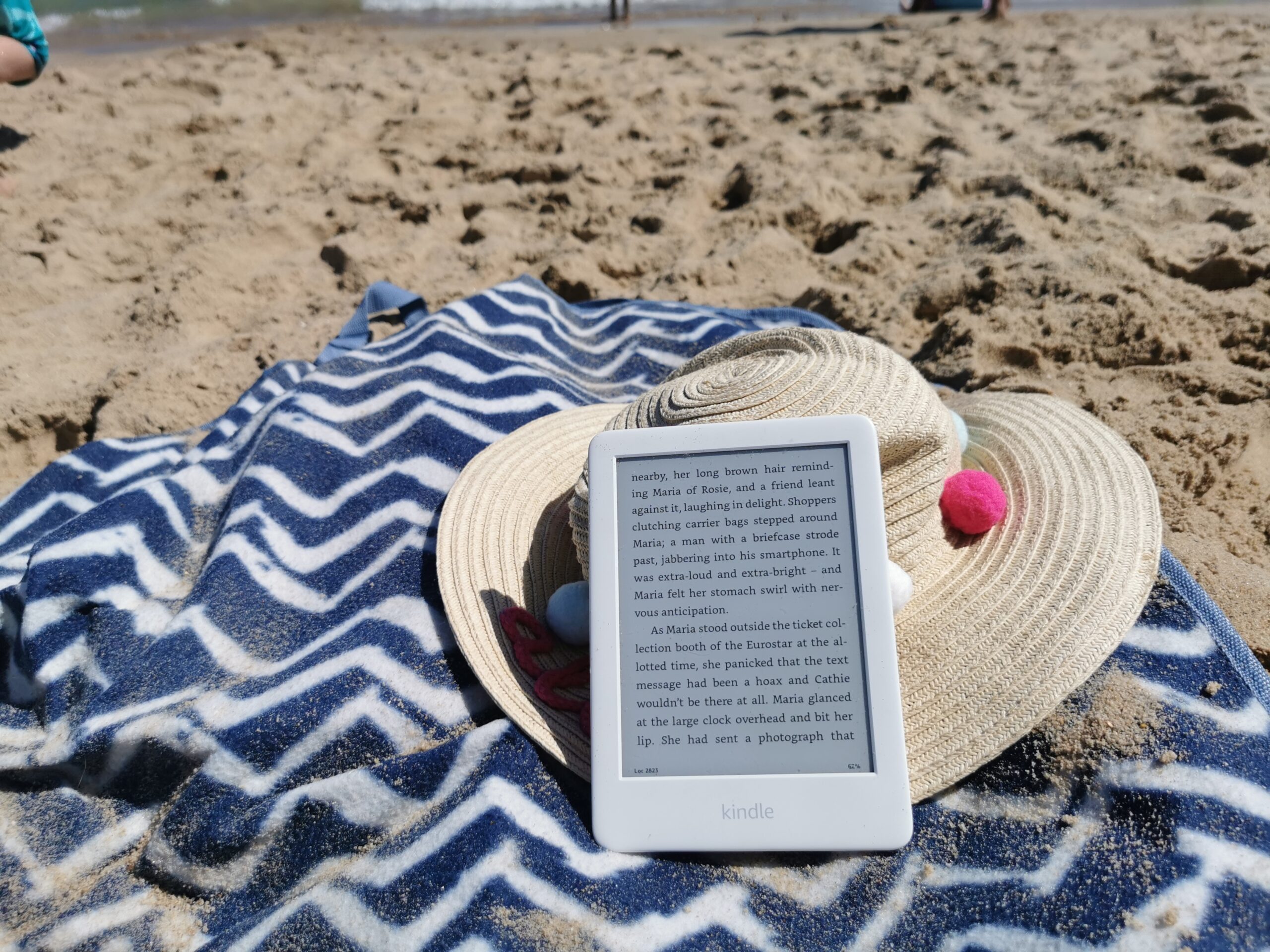 kindle reader on beach