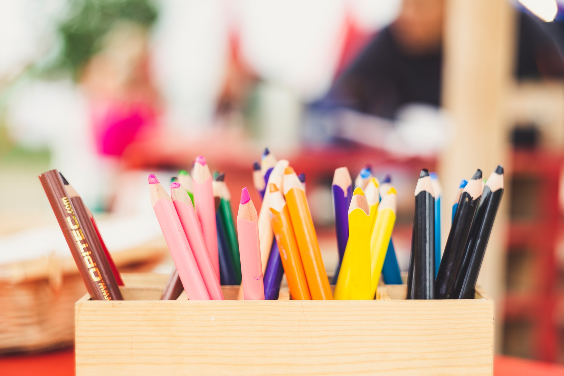 wooden pot of colouring pencils