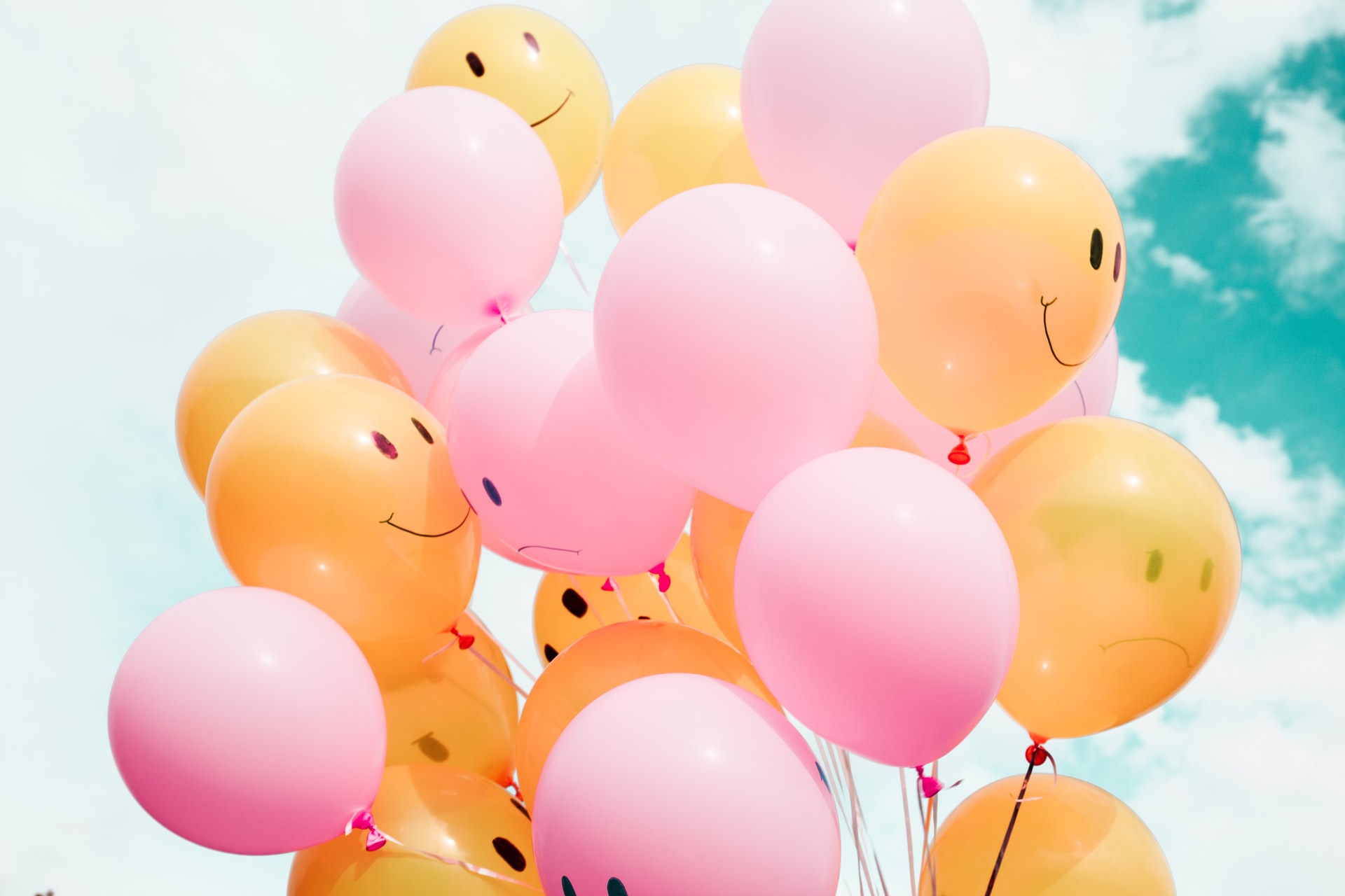 helium balloons with happy faces