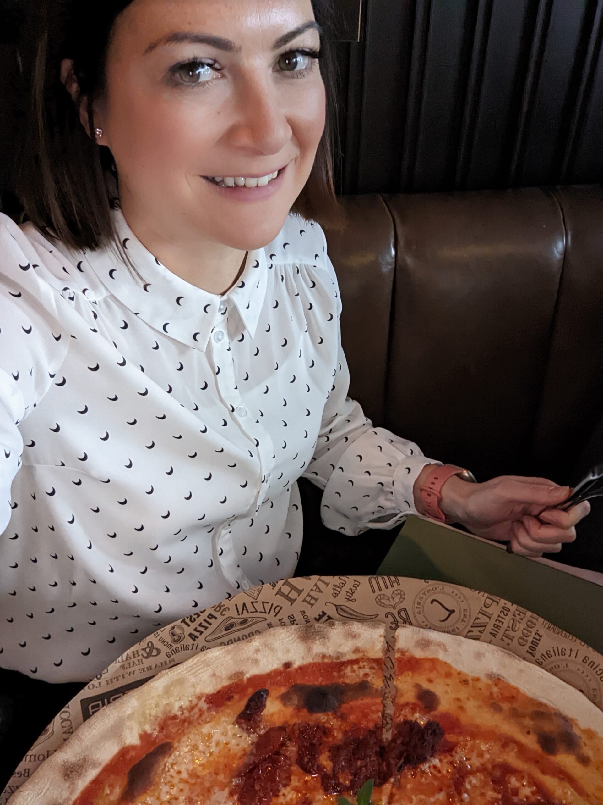 lady eating a pizza